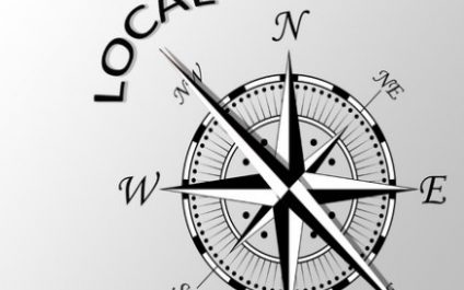 a compass with the words local on it